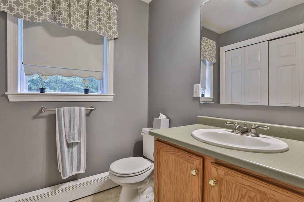 5 Hancock Road Windham, NH 03087 - Photo 22 of 41 a bathroom with a granite countertop sink toilet and a mirror