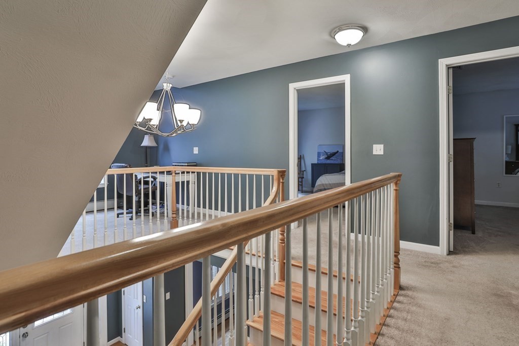 5 Hancock Road Windham, NH 03087 - Photo 23 of 41 a view of staircase with railing and a chandelier