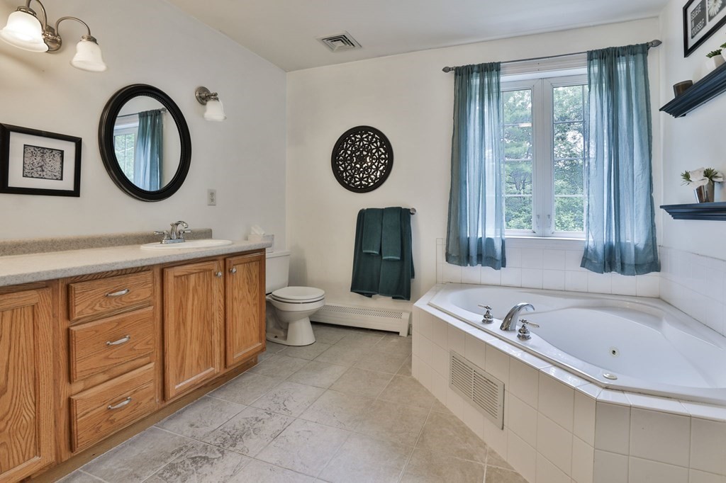 5 Hancock Road Windham, NH 03087 - Photo 26 of 41 a large spacious bathroom with a granite countertop tub and a large mirror