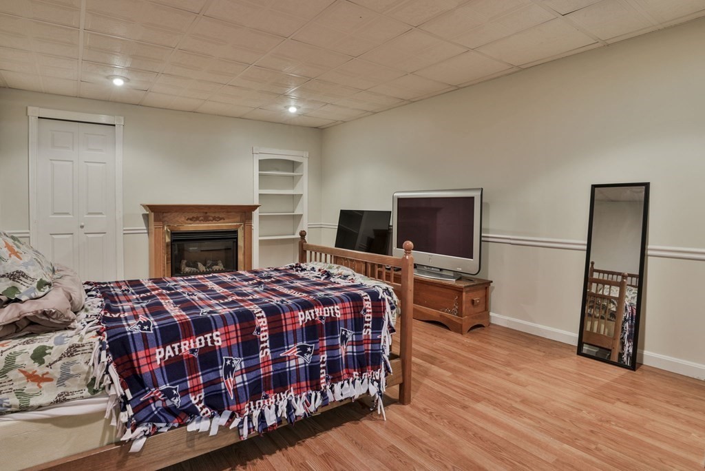 5 Hancock Road Windham, NH 03087 - Photo 32 of 41 a bedroom with a bed and a flat screen tv