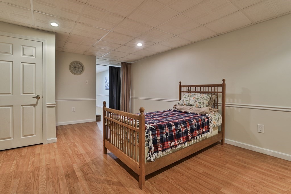 5 Hancock Road Windham, NH 03087 - Photo 33 of 41 a bed room with a bed and a chair