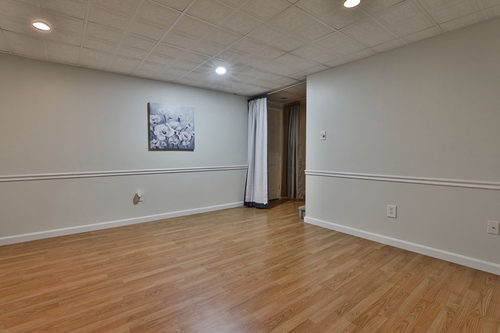 5 Hancock Road Windham, NH 03087 - Photo 34 of 41 a view of an empty room with wooden floor