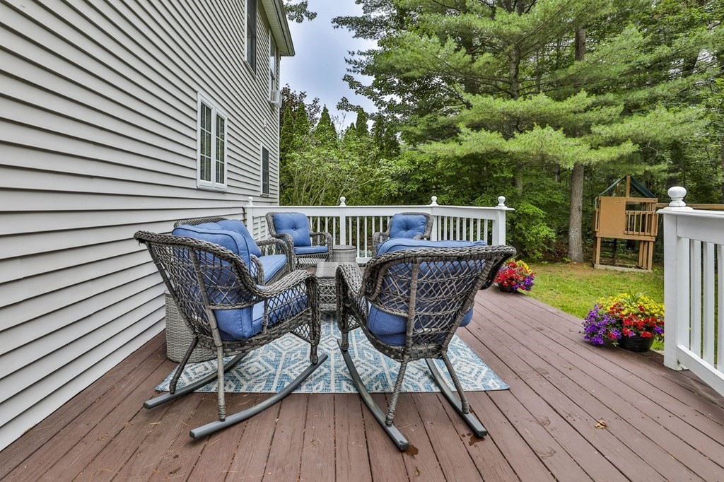 5 Hancock Road Windham, NH 03087 - Photo 37 of 41 a view of a chair and table on the deck