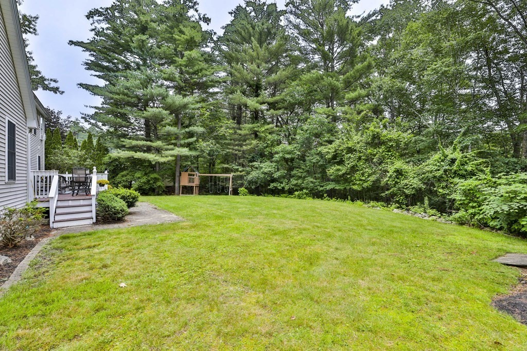 5 Hancock Road Windham, NH 03087 - Photo 40 of 41 a view of a backyard with couches plants and large trees