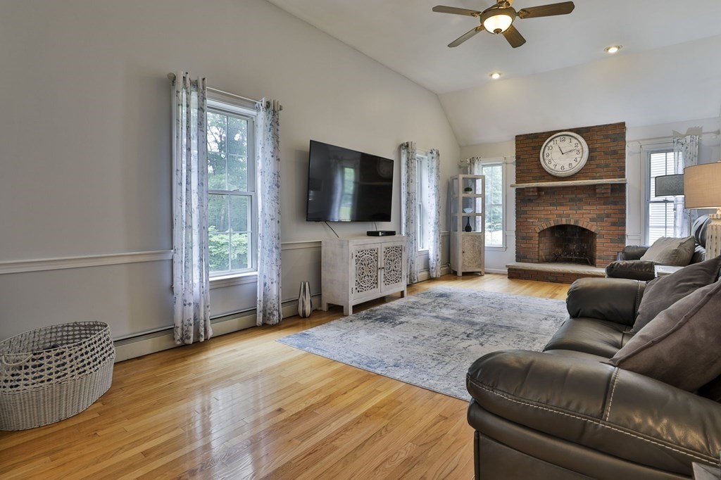 5 Hancock Road Windham, NH 03087 - Photo 10 of 41 a living room with furniture and a flat screen tv