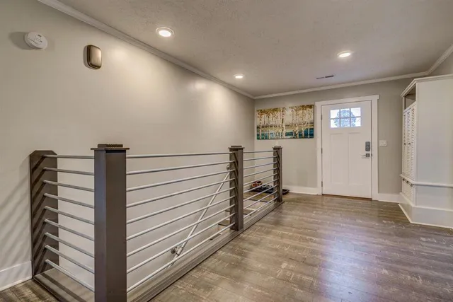 a view of a hallway with stairs