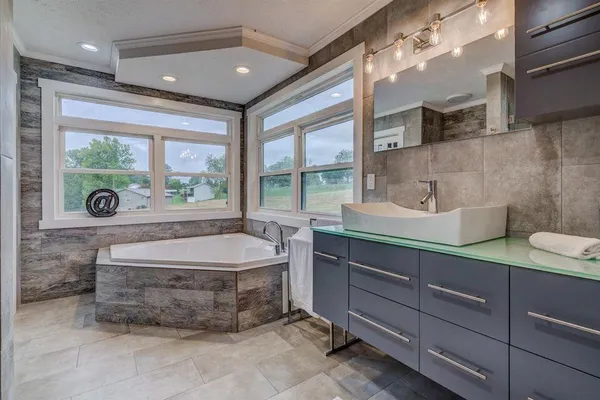 a room with a washing machine and a sink