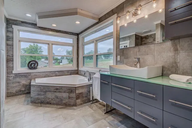 a room with a washing machine and a sink