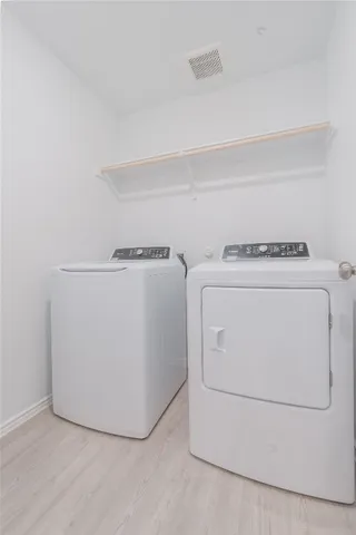 a view of an empty room and a window