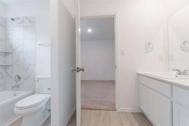 an empty room with closet and bathroom