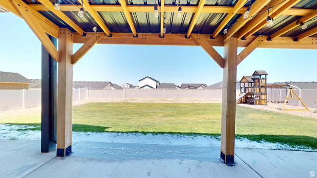 1127 4240 North Enoch, UT 84721 - Photo 45 of 56 Fenced backyard featuring a patio area, a residential view, and a playground