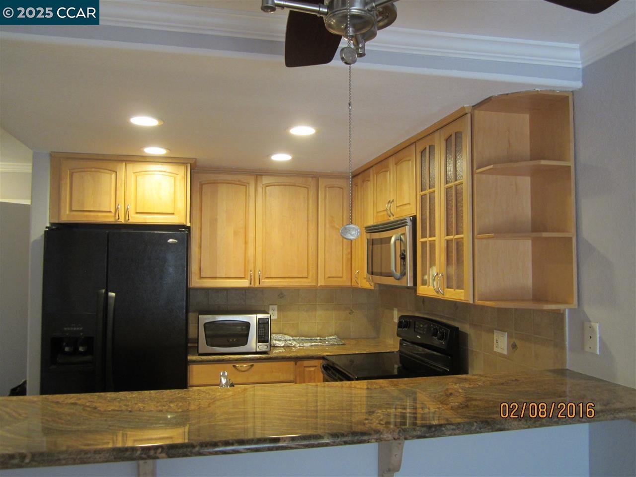 327 Pantano Circle Martinez, CA 94553 - Photo 3 of 11 a kitchen with stainless steel appliances granite countertop a refrigerator and a sink