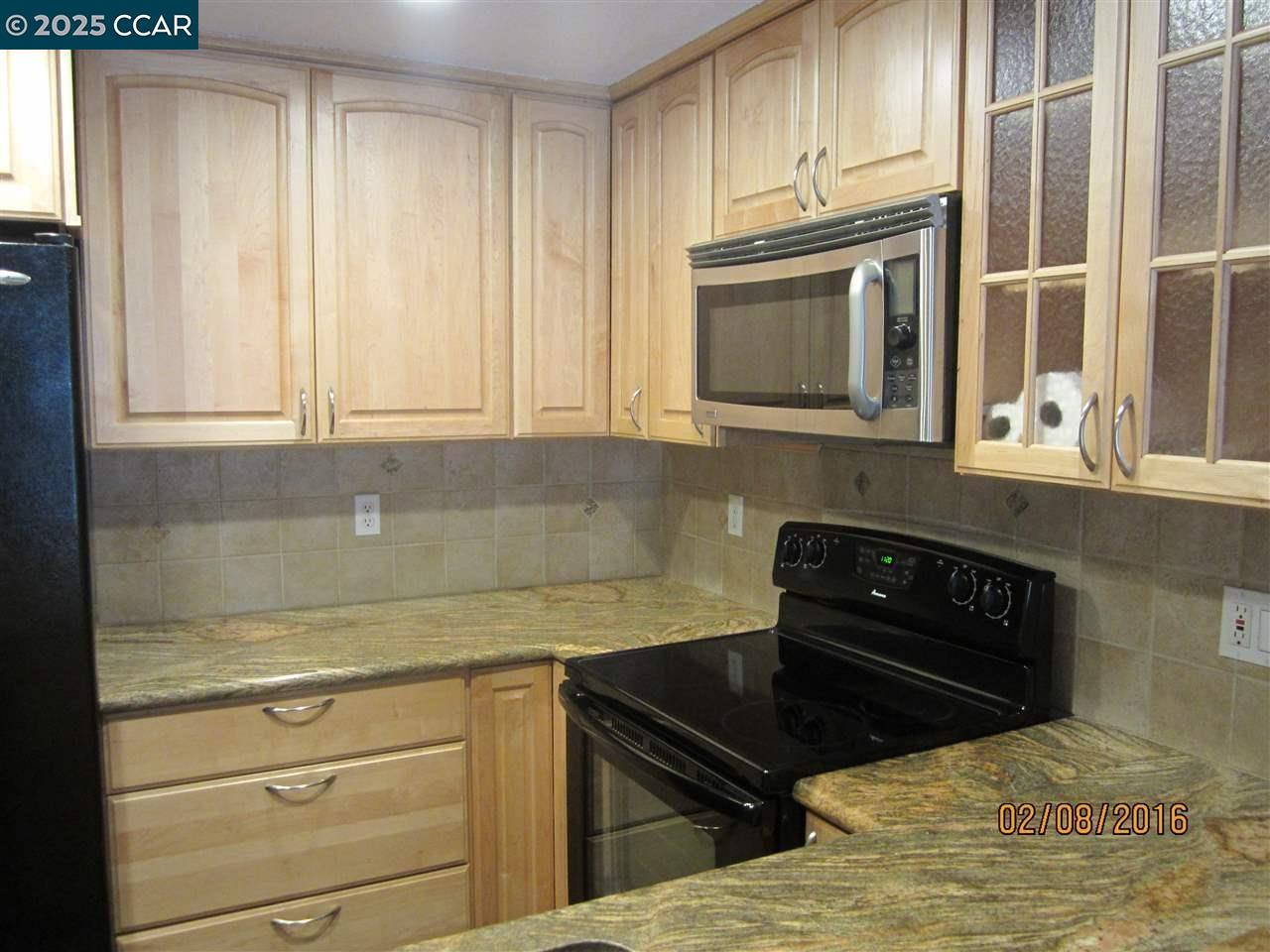 327 Pantano Circle Martinez, CA 94553 - Photo 4 of 11 a kitchen with granite countertop a stove and a granite counter tops