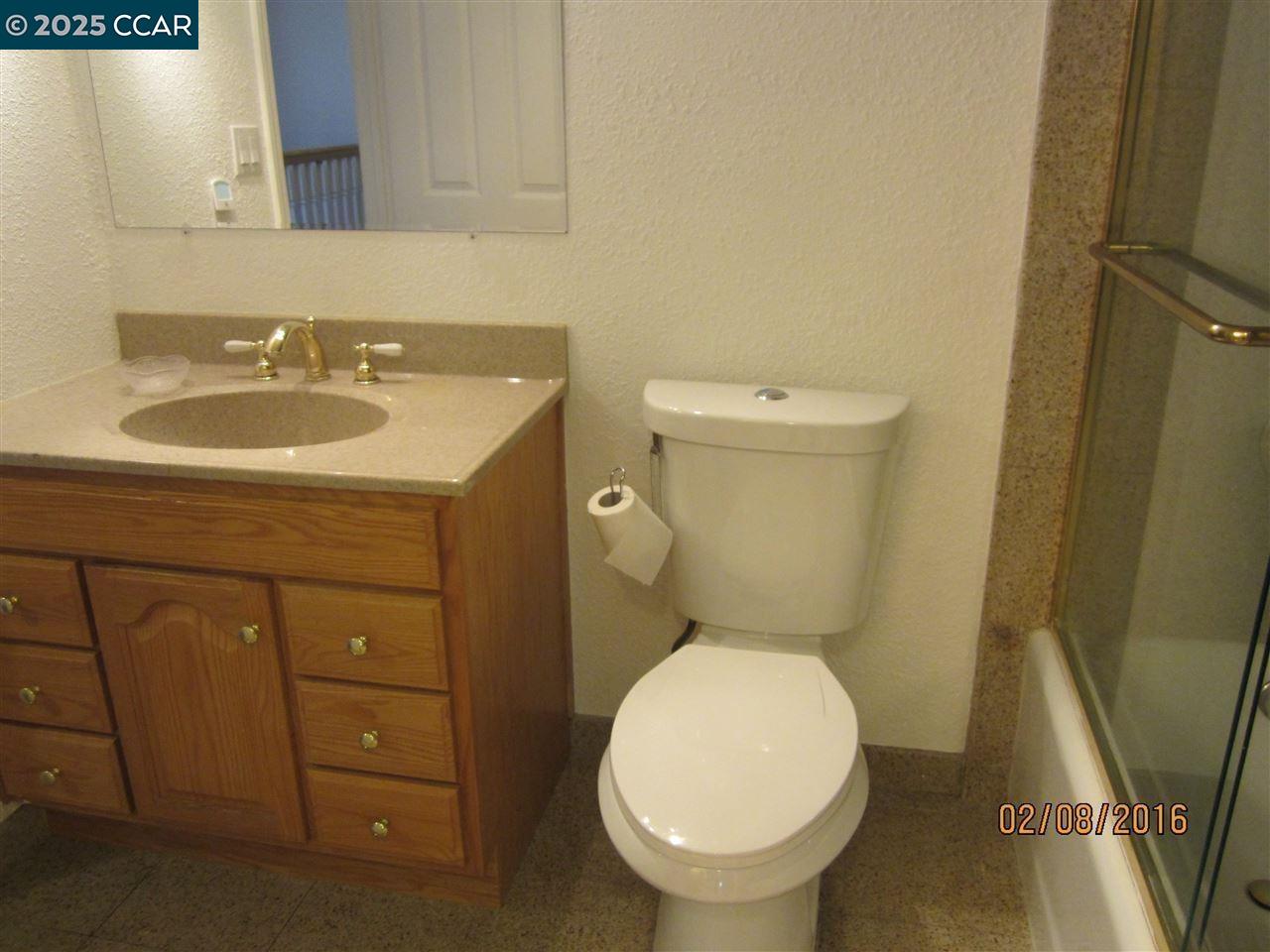327 Pantano Circle Martinez, CA 94553 - Photo 7 of 11 a bathroom with a sink a toilet and a mirror