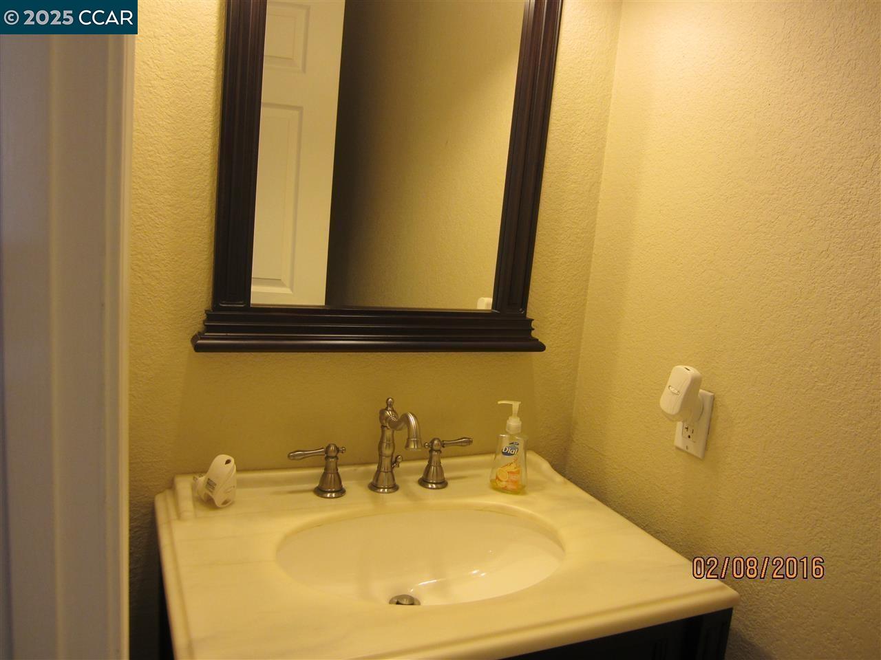 327 Pantano Circle Martinez, CA 94553 - Photo 8 of 11 a bathroom with a sink and a mirror