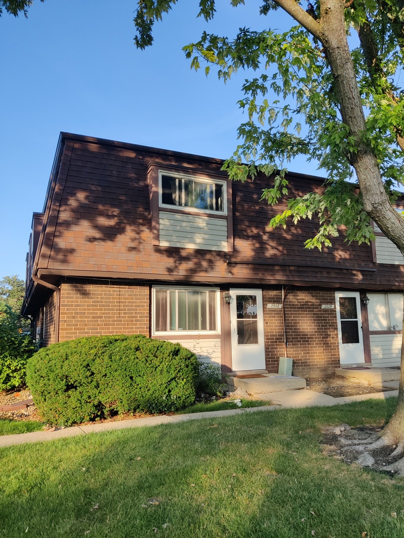 2526 Berkshire Court, Unit 2526 Waukegan, IL 60087 - Photo 1 of 16 front view of a house with a yard