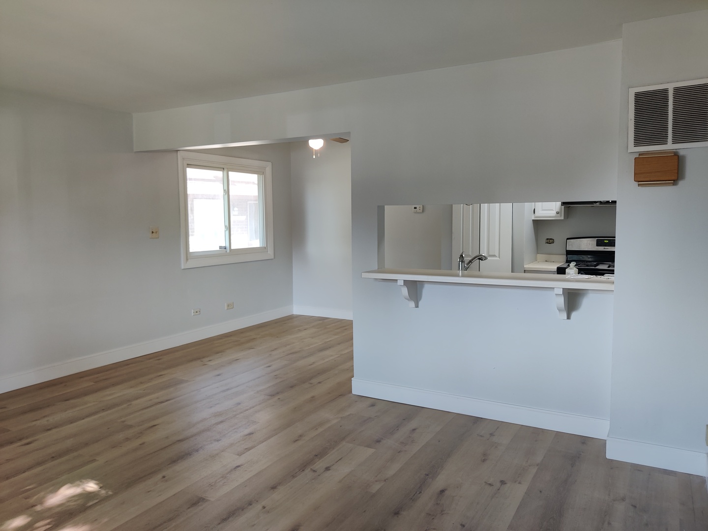 2526 Berkshire Court, Unit 2526 Waukegan, IL 60087 - Photo 2 of 16 a view of kitchen with wooden floor and electronic appliances