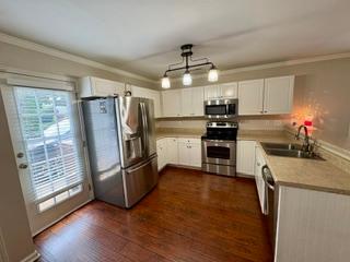 106 Antique Court Pendleton, SC 29670 - Photo 10 of 18 Prepare culinary masterpieces in this well-appointed kitchen, featuring a suite of modern appliances and rich hardwood flooring.