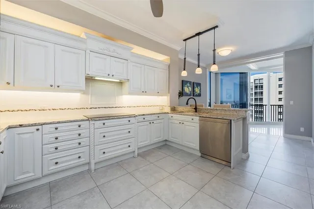 a kitchen with granite countertop white cabinets and white appliances