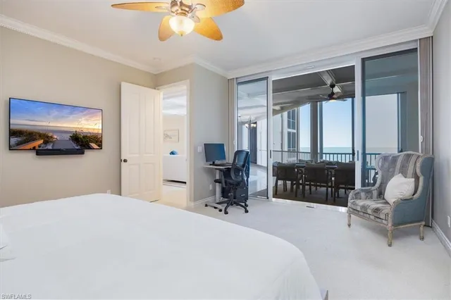 a bedroom with a bed and large mirror