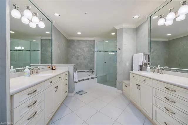 a bathroom with a double vanity sink mirror and double