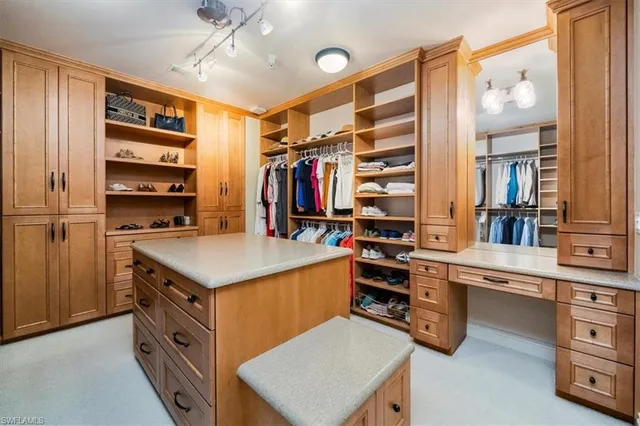 a kitchen with stainless steel appliances granite countertop a stove and cabinets
