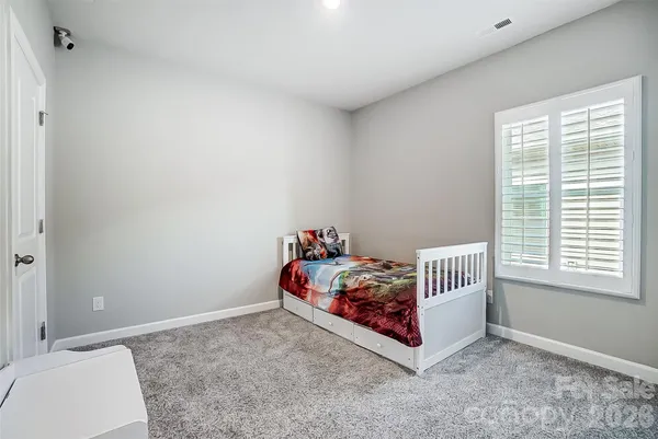 a room with a bed and a window