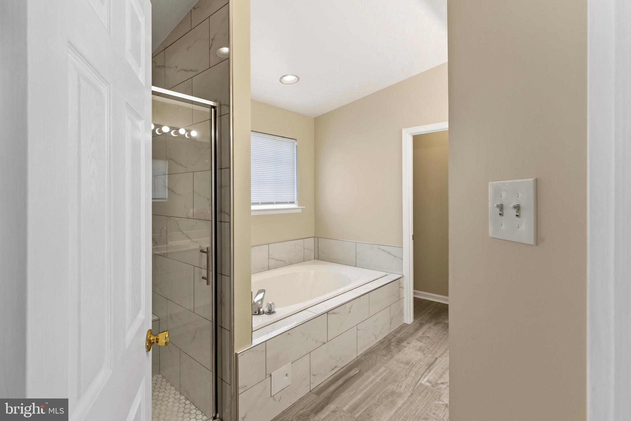 4704 Denview Way Baltimore, MD 21206 - Photo 27 of 42 a bathroom with a tub and shower