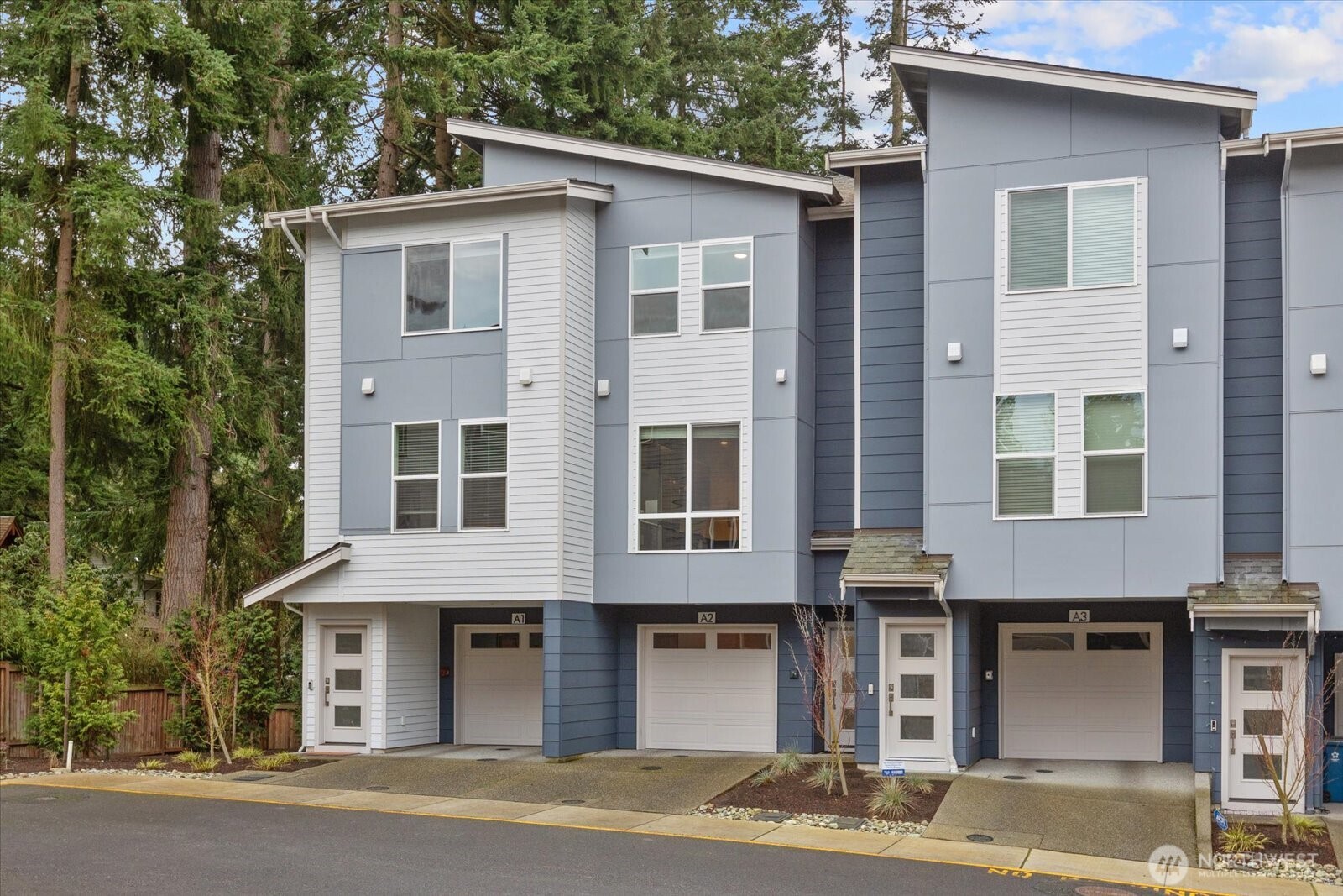 23413 Edmonds Way, Unit A2 Edmonds, WA 98026 - Photo 1 of 40 a front view of a house with a garage