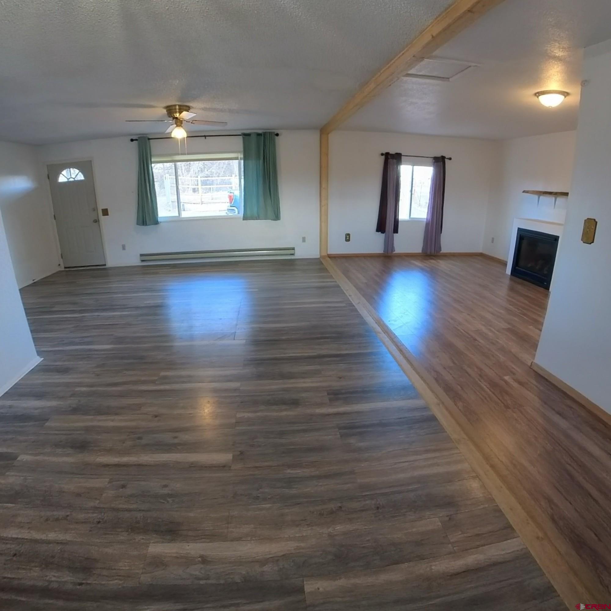 20268 Fairview Road Austin, CO 81410 - Photo 9 of 19 a view of an empty room with window and wooden floor