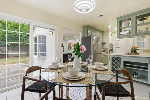 a dining room with furniture and window