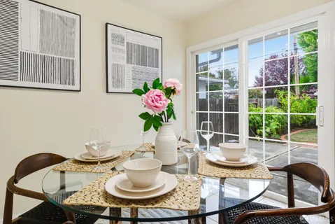 a view of a dining room with furniture window and outside view