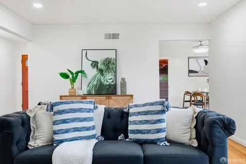 a bedroom with a bed and a couch