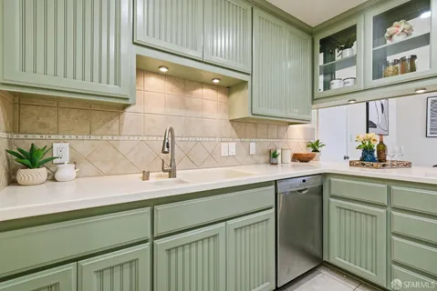 a kitchen with cabinets a sink and dishwasher