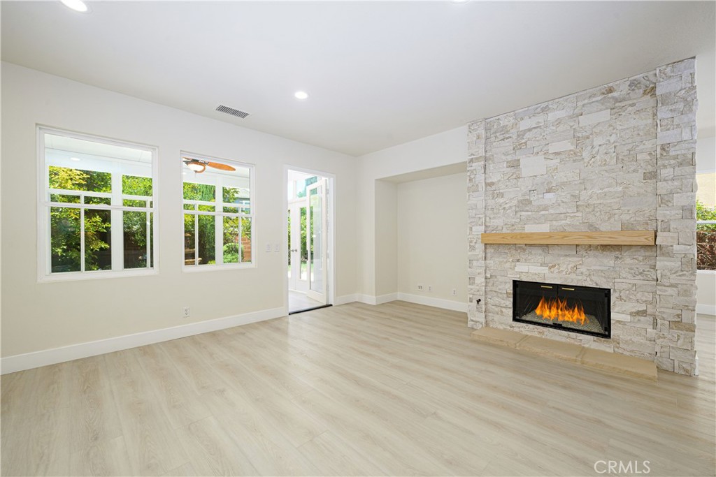 15 Plum Street Ladera Ranch, CA 92694 - Photo 27 of 113 a view of an empty room with a fireplace and a window