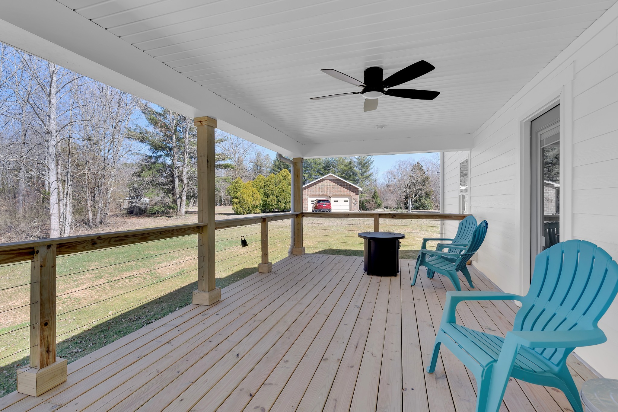 591 Ghea Road Normandy, TN 37360 - Photo 11 of 48 a living room with a floor to ceiling window and wooden floor