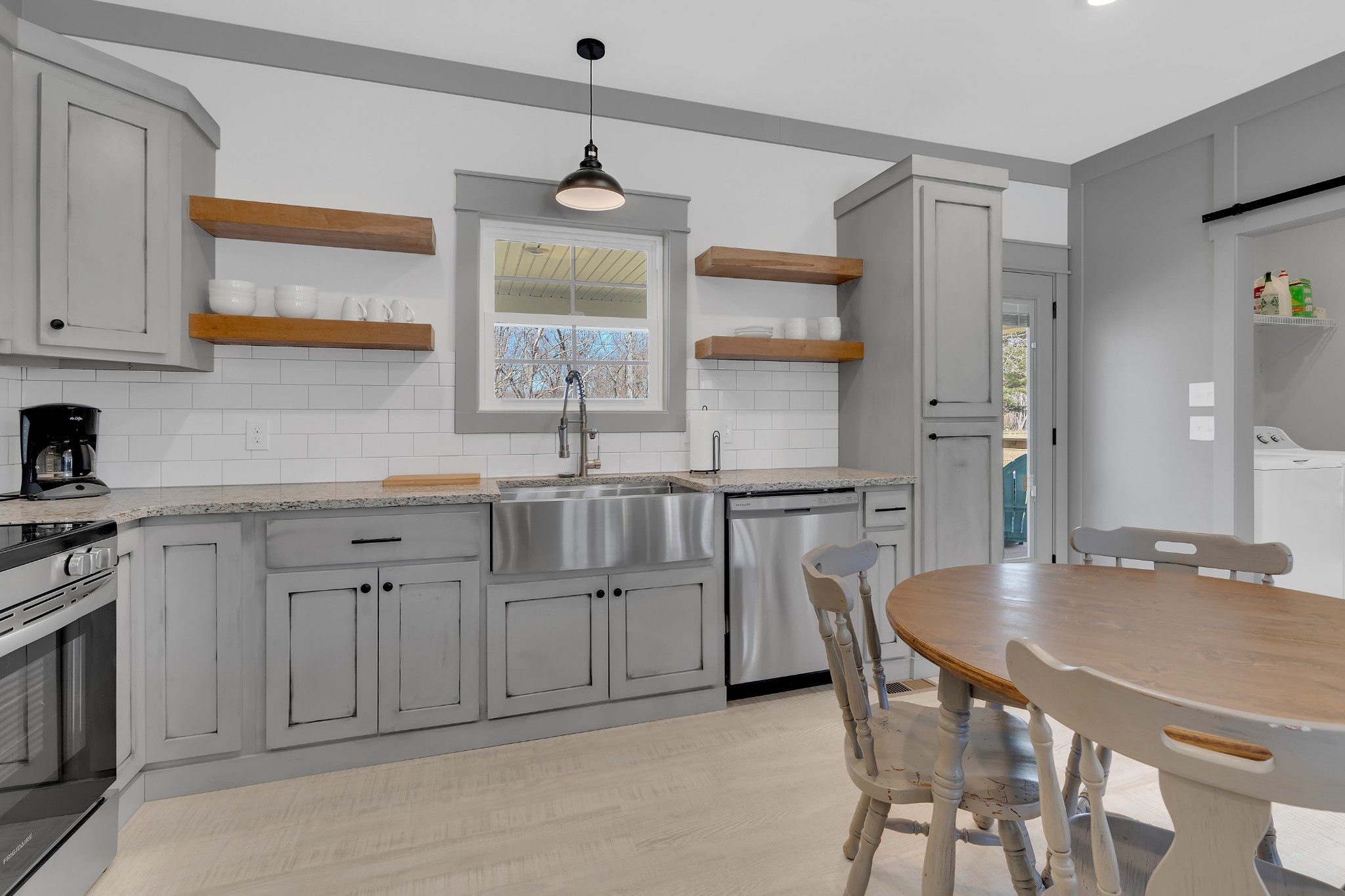 591 Ghea Road Normandy, TN 37360 - Photo 28 of 48 a kitchen with cabinets table and chairs