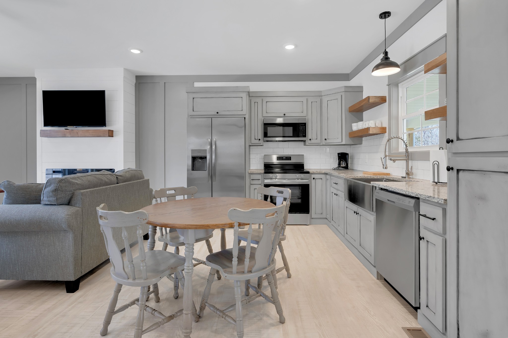 591 Ghea Road Normandy, TN 37360 - Photo 30 of 48 a living room with stainless steel appliances furniture and a kitchen view