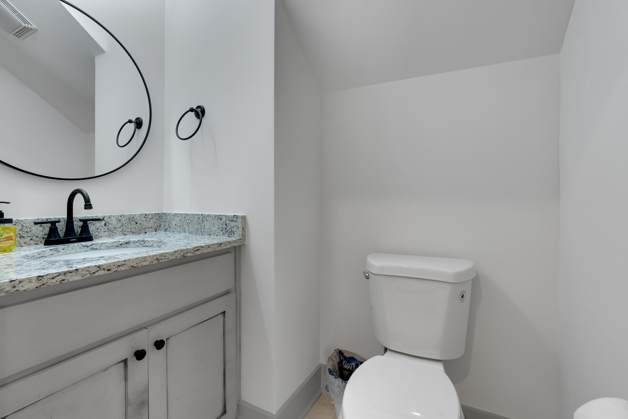 591 Ghea Road Normandy, TN 37360 - Photo 33 of 48 a bathroom with a granite countertop toilet sink and mirror