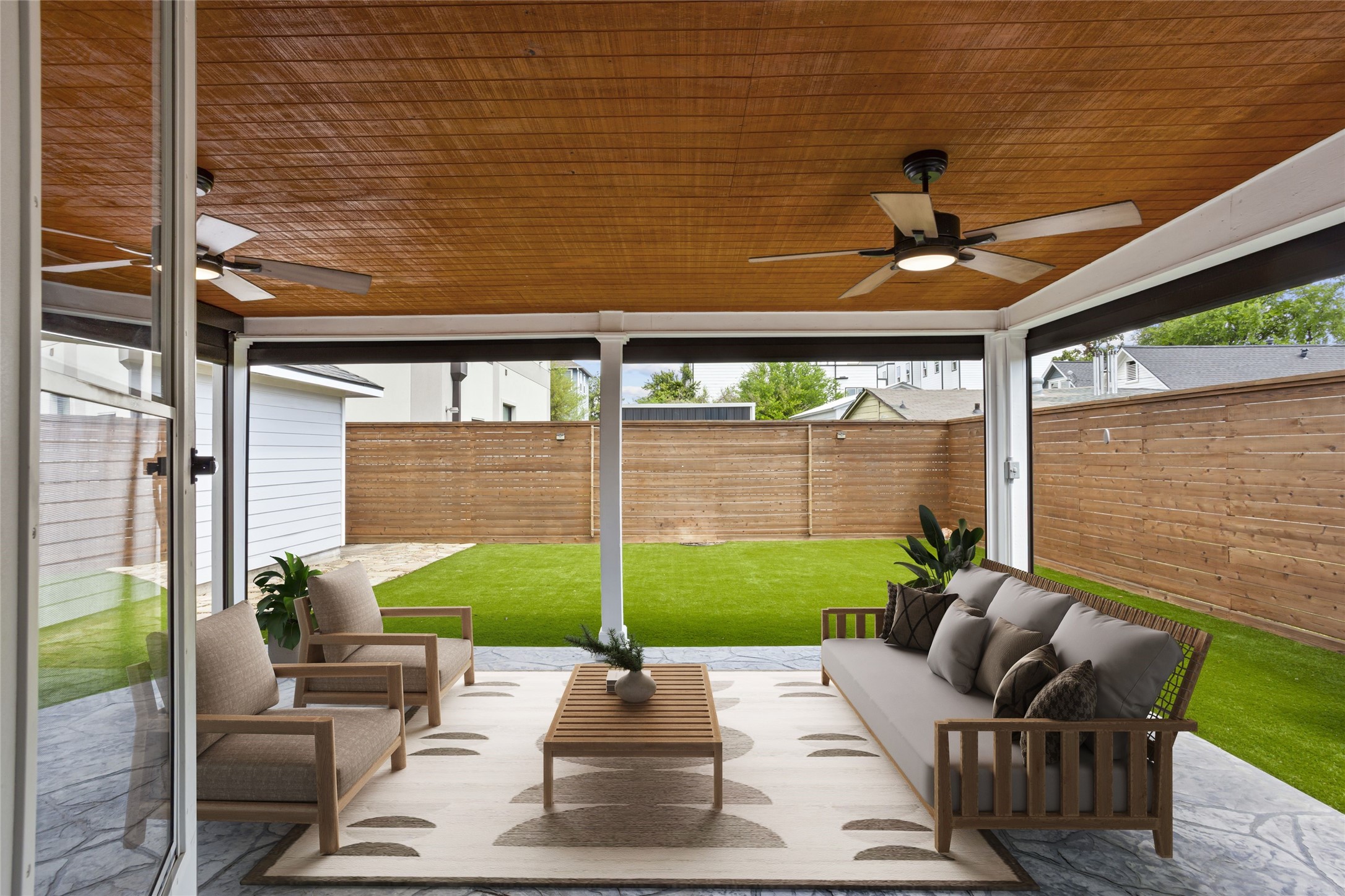 3105 Garrow Street Houston, TX 77003 - Photo 20 of 26 Covered back patio with remote controlled roll down shades for added comfort and privacy.