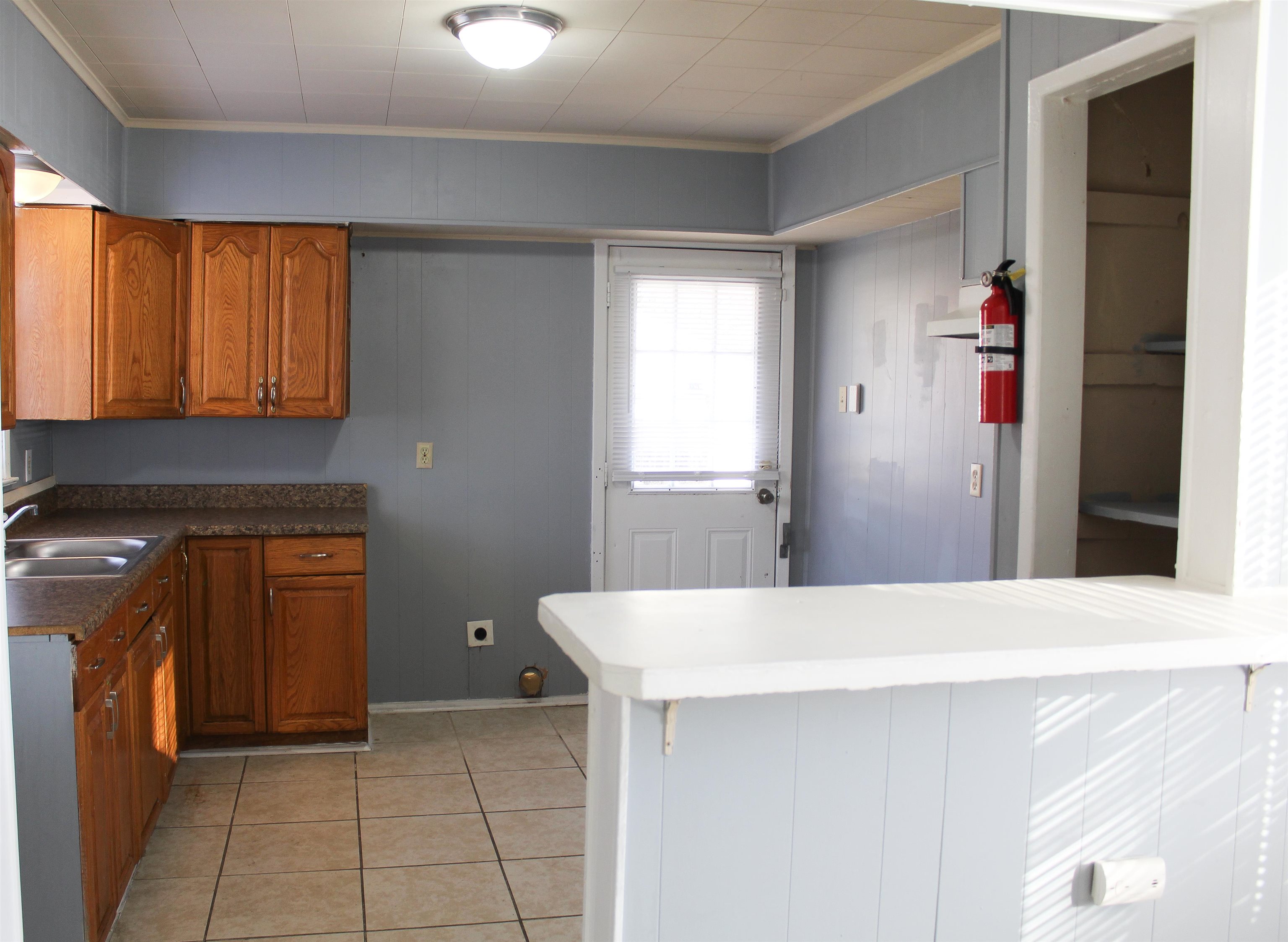 1576 Railton Road Memphis, TN 38111 - Photo 8 of 12 a kitchen with a sink and cabinets