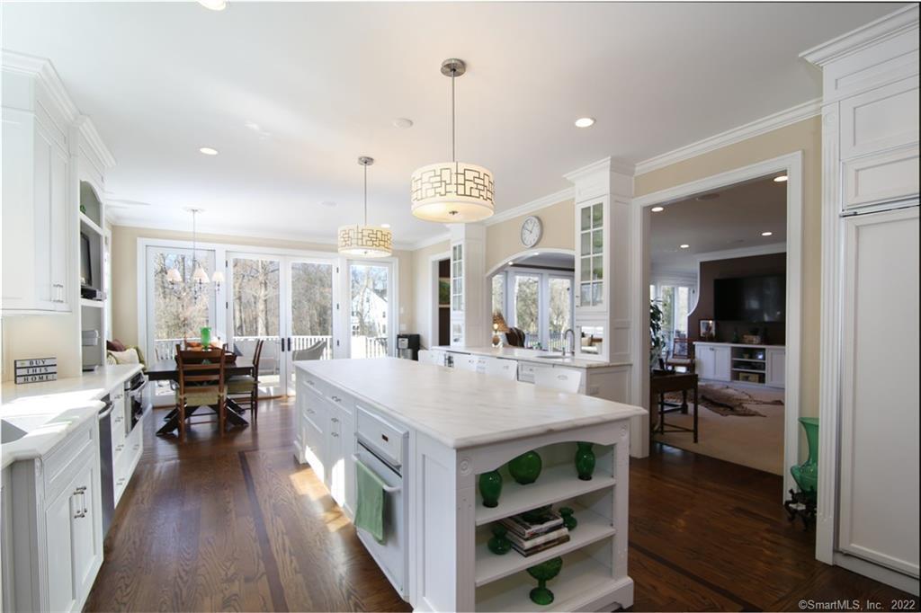 a large kitchen with kitchen island a large island in the center