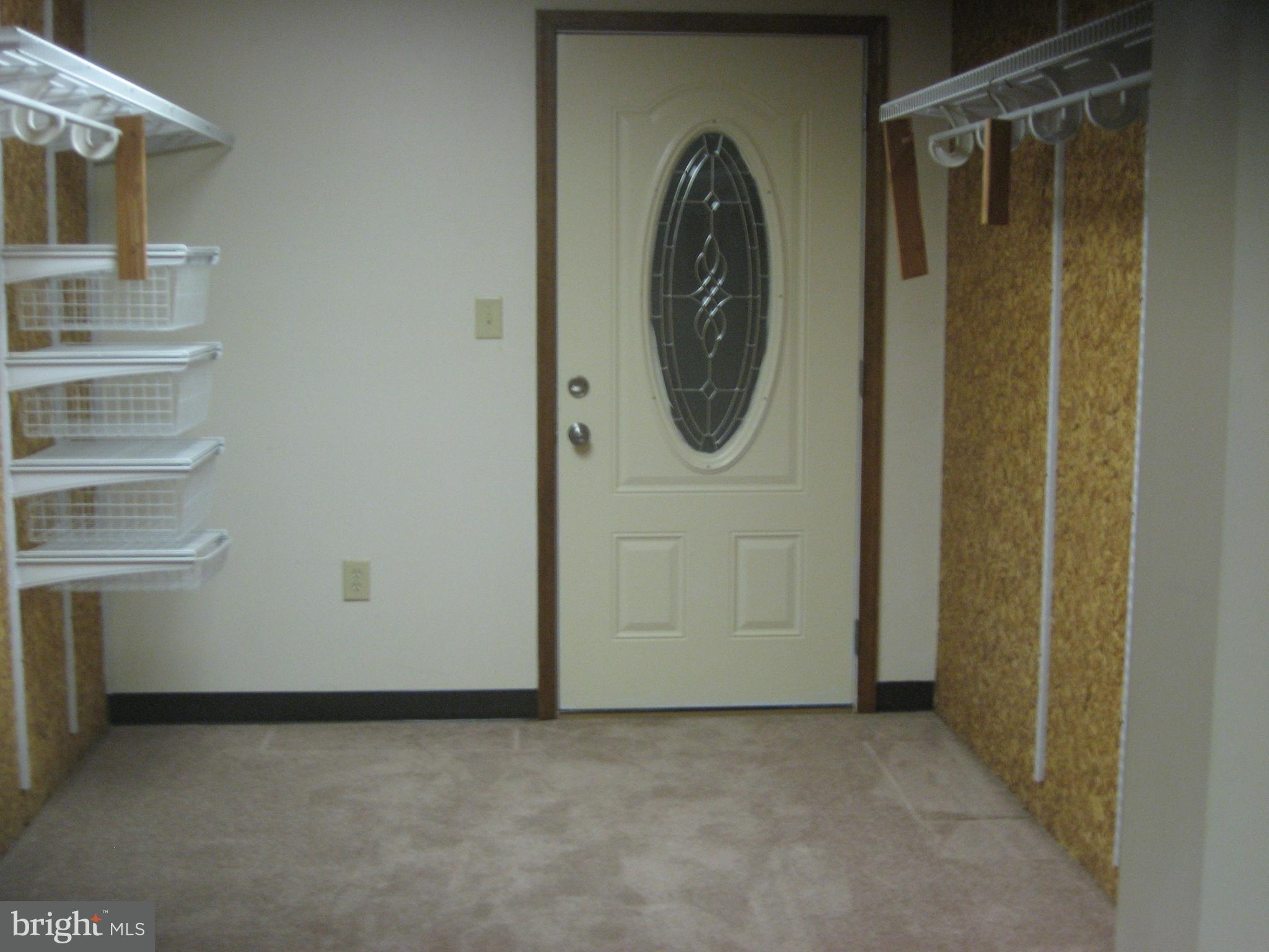 5894 York Road Spring Grove, PA 17362 - Photo 29 of 43 Basement bedroom closet with door leading outside.