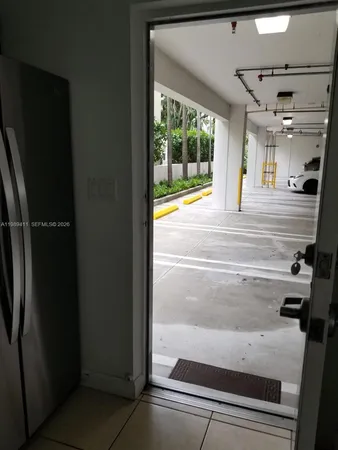 a view of bathroom with bathtub and door