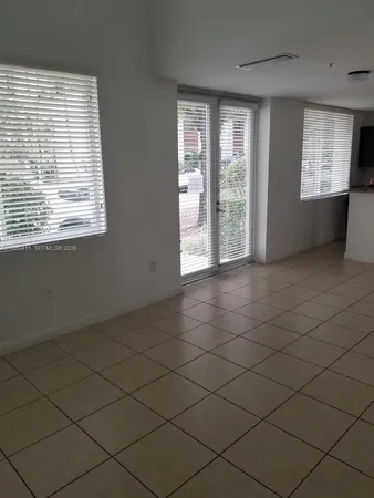 a view of an empty room and window