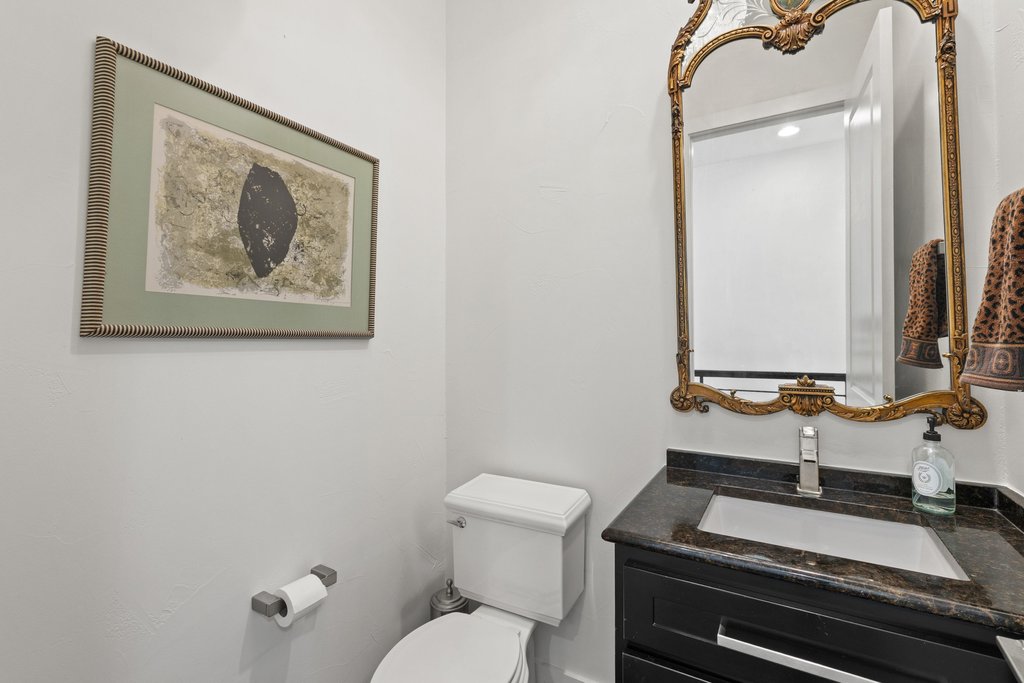 212 Marina View Way, Unit 11A Lakeway, TX 78734 - Photo 11 of 19 a bathroom with a toilet a sink and mirror