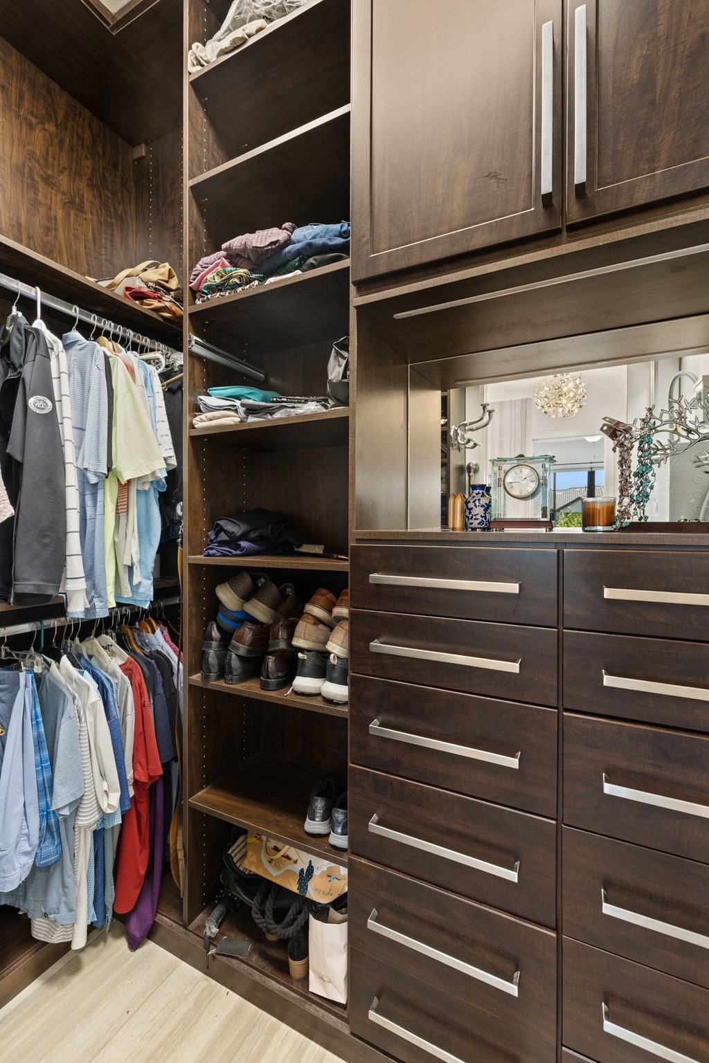 212 Marina View Way, Unit 11A Lakeway, TX 78734 - Photo 14 of 19 a view of walk in closet with clothes and shoes