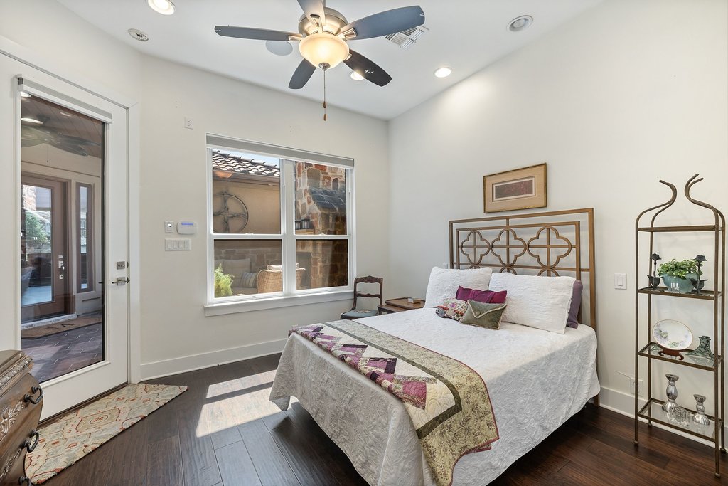 212 Marina View Way, Unit 11A Lakeway, TX 78734 - Photo 19 of 19 a bedroom with a large bed and a window