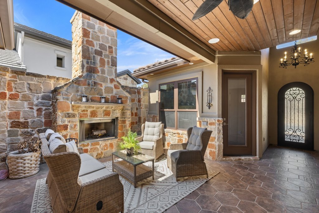 212 Marina View Way, Unit 11A Lakeway, TX 78734 - Photo 5 of 19 a outdoor space with patio furniture and a fireplace