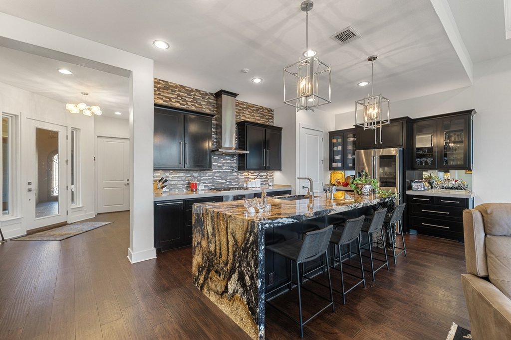 212 Marina View Way, Unit 11A Lakeway, TX 78734 - Photo 8 of 19 a large kitchen with a table and chairs